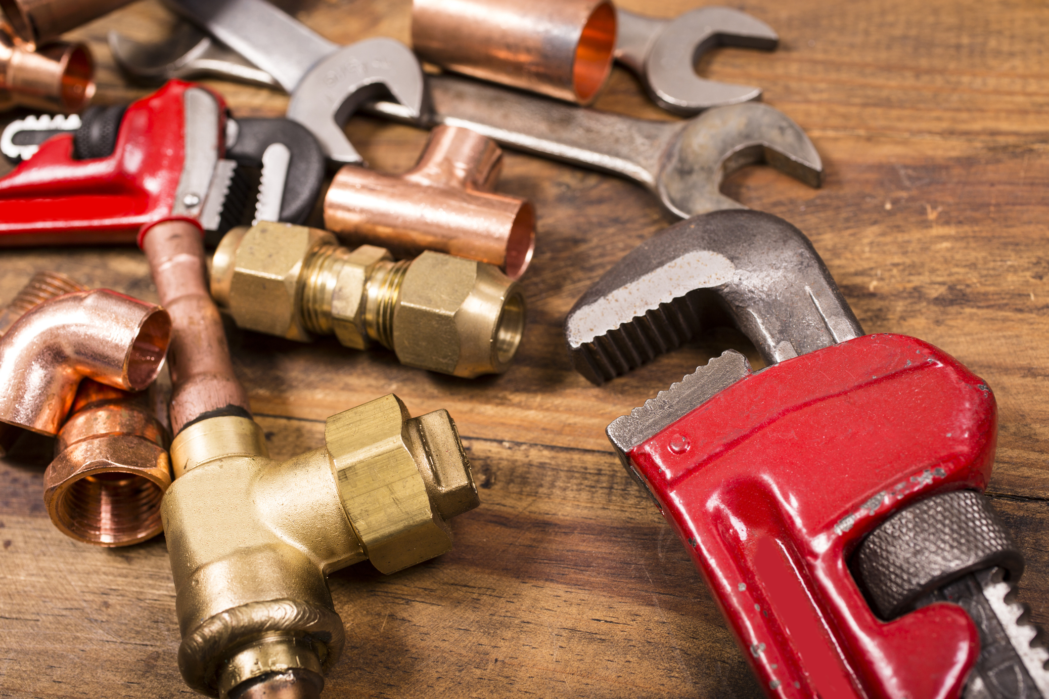 Plumbing Tools on Wooden Table